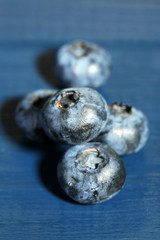 Tasty ripe blueberries, on wooden background