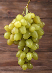 Bunch of grape on wooden background