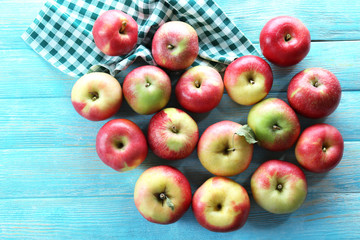 Juicy apples on wooden table, close-up