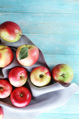 Juicy apples on wooden table, close-up