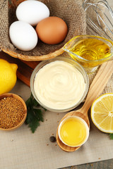 Mayonnaise ingredients on wooden background