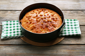 Homemade apple pie on wooden table