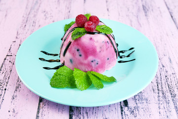 Delicious ice cream with fresh berries and mint leaves
