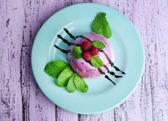 Delicious ice cream with fresh berries and mint leaves