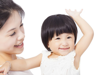 Happy mother holding smiling child baby