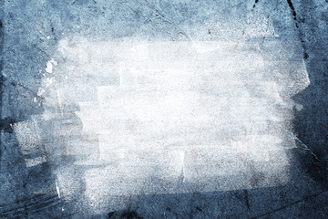 White paint on blue grunge textured concrete wall background. Copy space