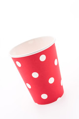 Red polka dot paper cup isolated on white background