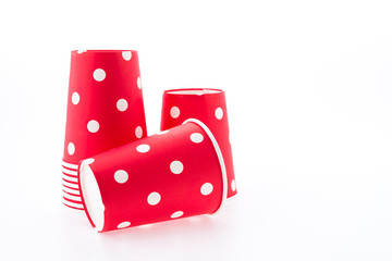 Red polka dot paper cup isolated on white background