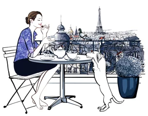 Gordijnen Vrouw aan het ontbijten op een balkon in Parijs © Isaxar