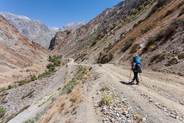 Obraz premium Hiker in high mountains.