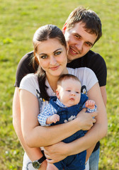 Fototapeta premium Happy young family in park