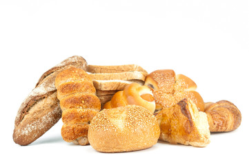 Composition with bread and rolls on white background.