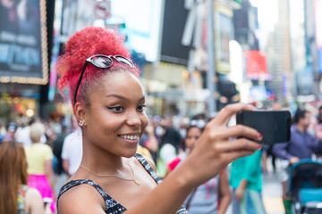 Beautiful Young Woman Taking Selfie in Times Square