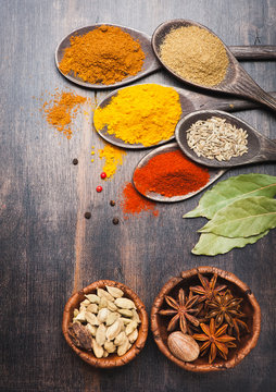 Spices in wooden spoons.  Food and cuisine ingredients.