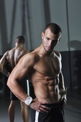 Fototapeta na wymiar Handsome Muscular Male Model With Perfect Body Posing