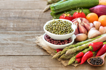 Mung and azuki beans in a bowl and vegetables