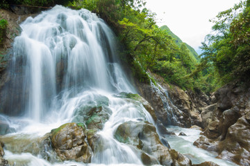 Fototapeta na wymiar Waterfall deep forest