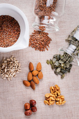 Mix nuts (almonds, hazelnuts, walnuts) on a wooden table