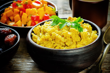 red lentils with curry and dates and a salad of mango and tomato