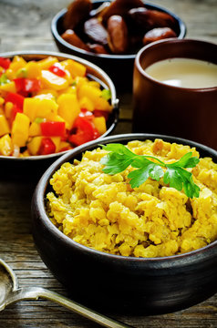 red lentils with curry and dates and a salad of mango and tomato