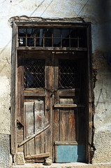 Old wooden door in ruin