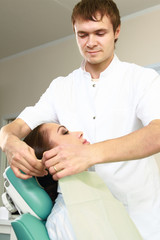 Young woman with dentist in a dental surgery. Healthcare