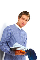 Young college guy  holding a books