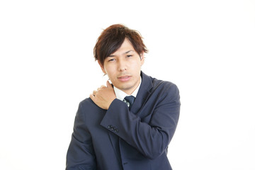 肩痛を訴えるビジネスマン