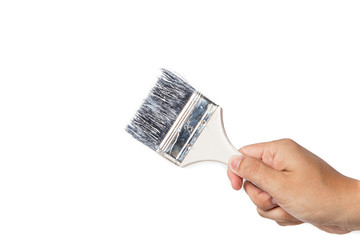 The hand with a brush paints in white background