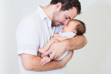 happy father with a sleeping baby