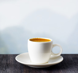 Cup of coffee on highlands background