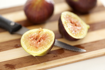 Sliced figs on cutting board