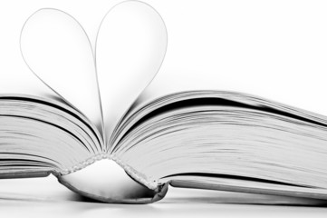 pages of book curved into heart shape