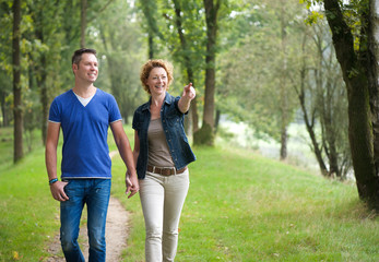 Smiling couple enjoying a walk outdoors