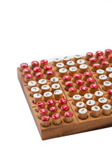 Sudoku board game close up on white