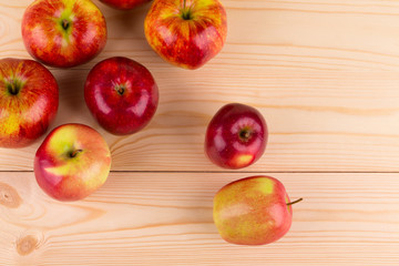 Fresh red apples on wood.