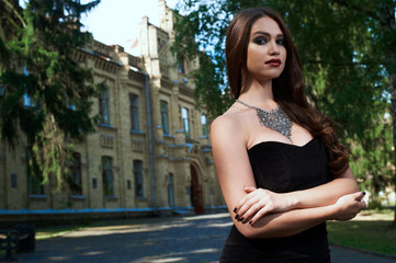 sexy woman in black dress and necklace