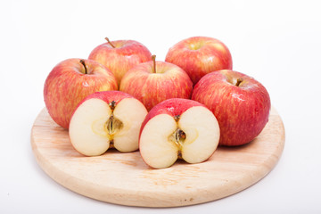 Naklejka na ściany i meble Apple sliced sections. Fruit isolated on wooden base