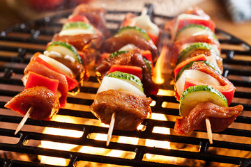 Grilling shashlik on barbecue grill