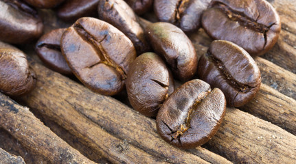 Coffee beans on wood background