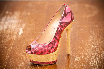 Women shoes pink high heels. Stylized snake skin. Vintage style