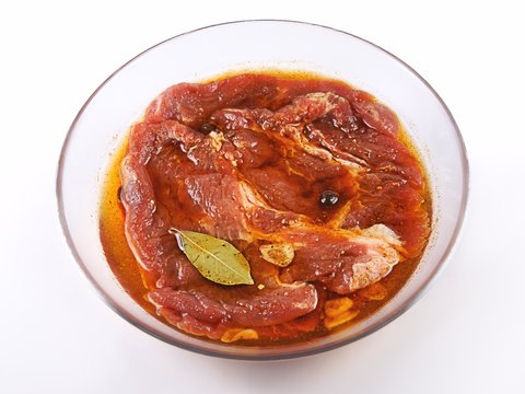 Meat, Pork in marinade on a glass plate