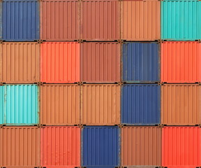 Stack of colorful freight shipping containers at the docks
