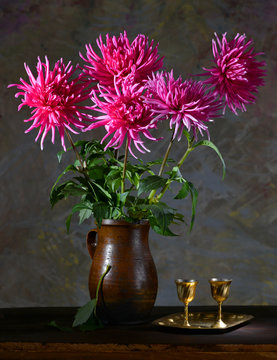 Still life with a bunch of asters on a dark background