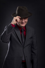 portrait of men with hat in the darkness