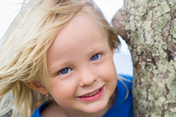 Fototapeta premium Cute close-up portrait of happy child at the beach