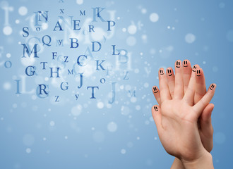 Happy smiley fingers looking at mixture of bokeh letters