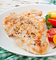 Grilled chicken breasts and vegetables