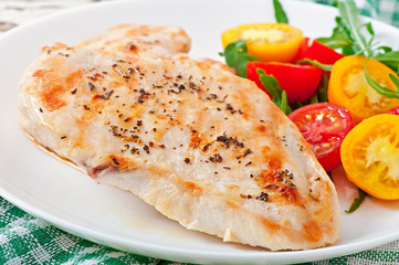 Grilled chicken breasts and vegetables
