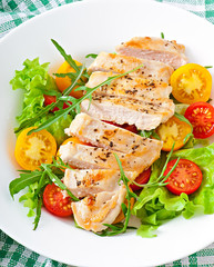 Grilled chicken breasts and fresh salad